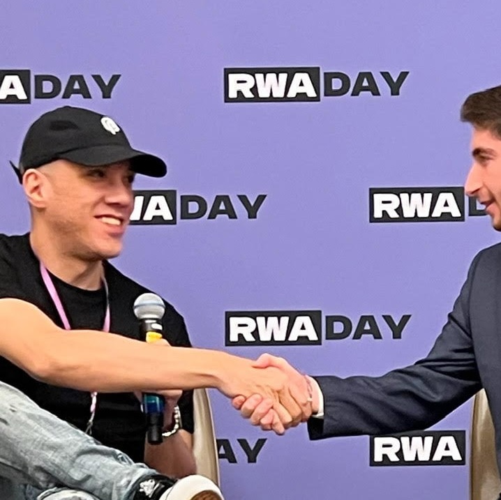 RWA partnership handshake at RWA Day